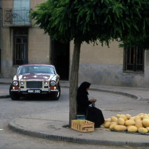 A melon seller in the town square.